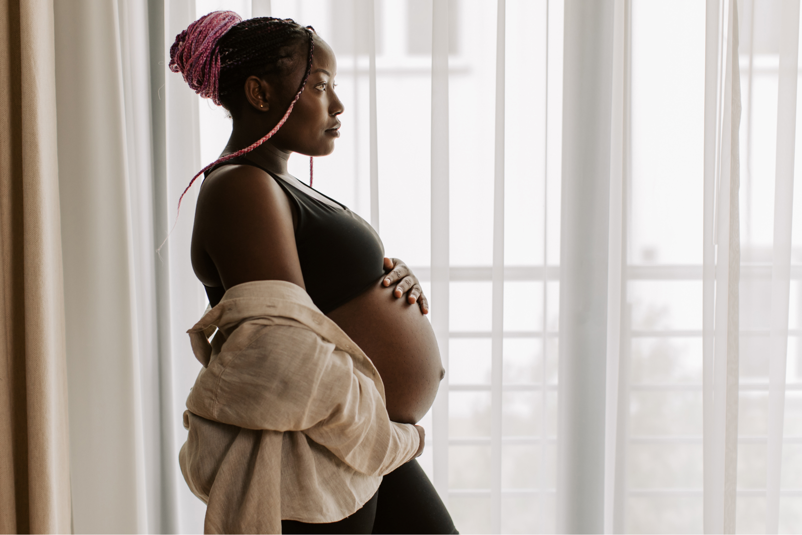 Pregnant mother by the window